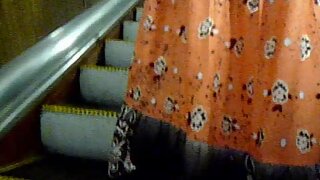UT_1472#A girl in a loose long sarafan. I've pushed my whole arm with a camera under her skir