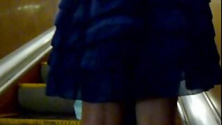 UT_1098#I was amazed by the beauty of a young girl in blue dress. On the stairs there was a m