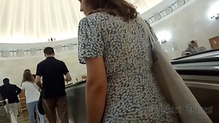 Ut_6001 # A tanned girl in a short blue and white dress is upskirted. Our cameraman lifted her