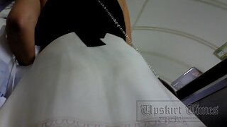 UT_2428#So stunning brunette cutie in wide white skirt in street upskit scene. The operator w