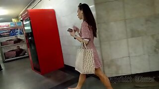 Ut_5929# Up the skirt of a tanned girl in a short red and white dress. Our cameraman managed t