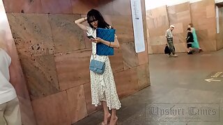 Ut_6086# Under the skirt of a girl in a long, multicolored dress. Our cameraman managed to sli