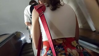 Ut_5977# A tanned girl in a wide, multicolored skirt gets an upskirt. Our cameraman managed to