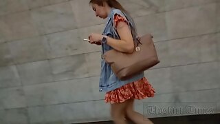Ut_5799# Under the skirt of a girl in a short orange dress. Our cameraman lifted her skirt sev