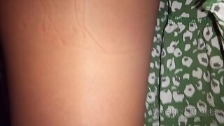 UT_4579#Under the skirt of a tanned beauty in a wide green dress. Our operator lifted her ski