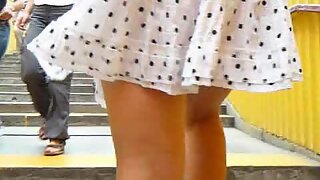 UT_824#This time I saw tall blond in a white and polka dot skirt. I made some pics of her wh