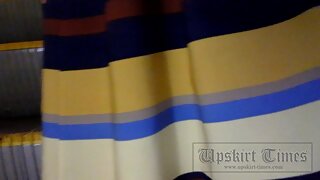 UT_2184#Slender beauty in long striped skirt. Cameraman pushed hand with camera up of her ski