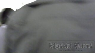 UT_1435#This girl has a lot of clothes on her, even too much for a good upskirt video, but an
