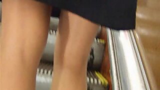 UT_718#This was a splendid chick in a classic black dress! The skirt was narrow and short, n